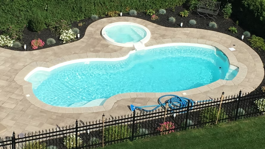 Elegant concrete finishing and patio space by Luxe Oasis Outdoors.